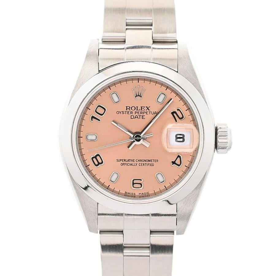 Rolex Ladies Date 79160 Salmon Dial Oyster Bracelet with Papers 2001: Rolex Ladies Date 79160 Salmon Dial Oyster Bracelet with Papers 2001 This ladies Rolex Date wristwatch features a salmon dial and a smooth bezel, paired with an Oyster bracelet. The reference number i