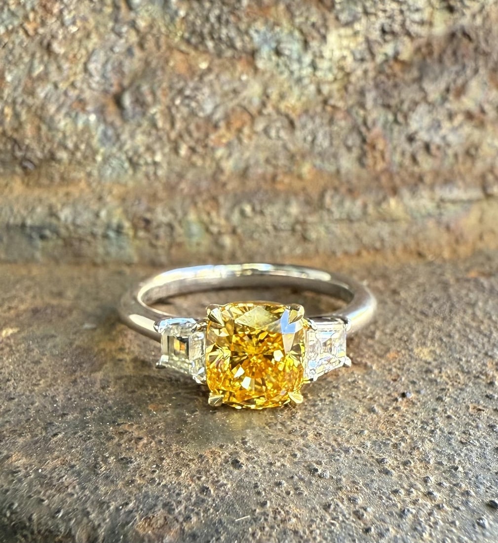18k Gold GIA Certified 1.98ctw Fancy Intense Orange Yellow Diamond Ring: 18k Gold GIA Certified 1.98ctw Fancy Intense Orange Yellow Diamond Ring This stunning engagement ring features a captivating 1.51ct natural cushion modified brilliant cut diamond, showcasing a fancy i