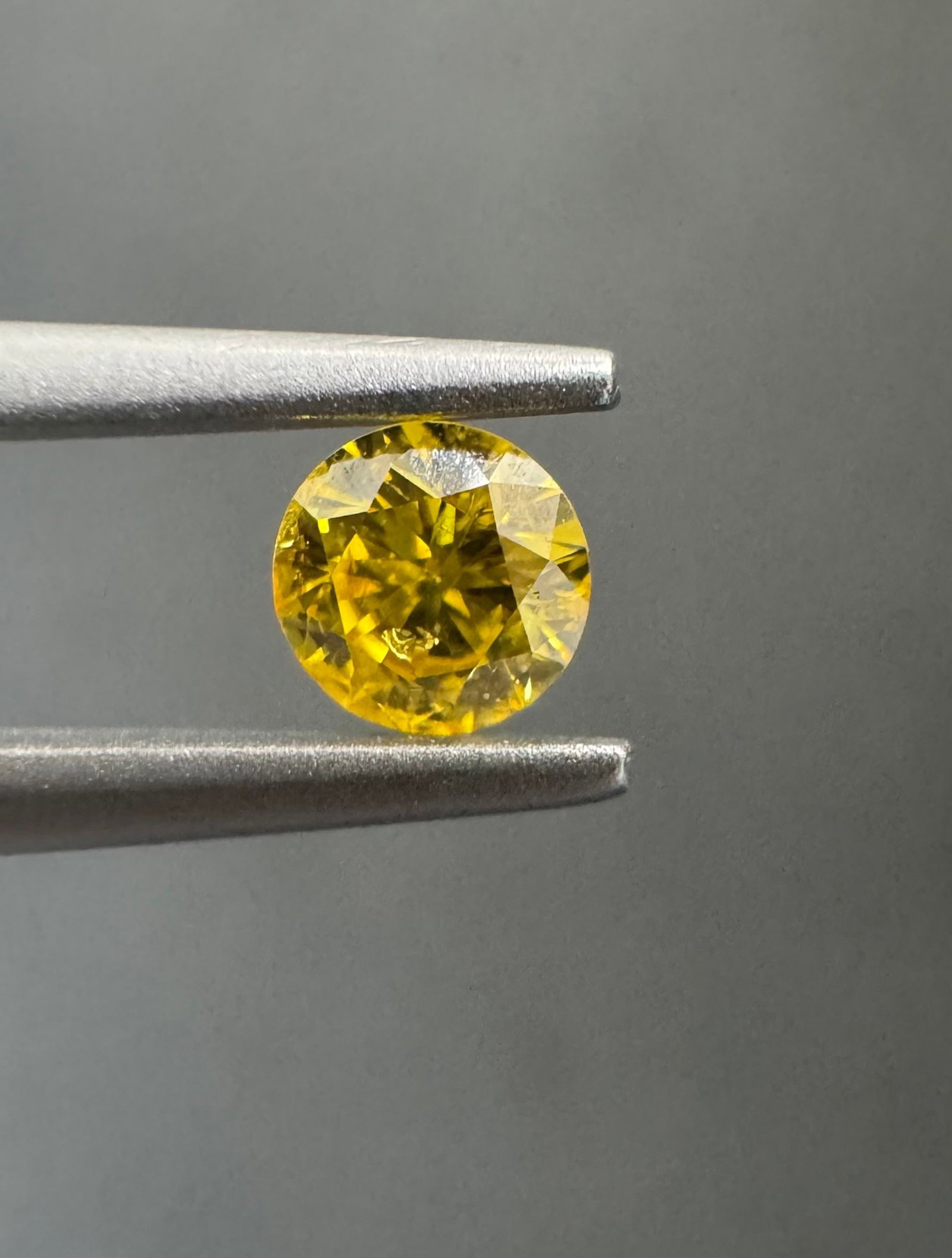 Loose Diamond - ROUND 0.19ct Fancy Vivid Orangey Yellow I2: Loose Diamond - ROUND 0.19ct Fancy Vivid Orangey Yellow I2 Source: Natural Shape: ROUND Carats: 0.19 Color: Fancy Vivid Orangey Yellow Certification: GIA The Diamond Depot Guarantee: All items in this