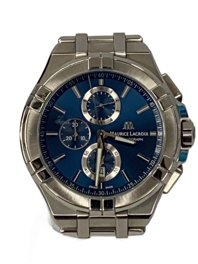 Maurice Lacroix blue quartz wristwatch Icon for men: Maurice Lacroix blue quartz wristwatch Icon for men This Maurice Lacroix Icon Quartz AI1018 is a men's Swiss wristwatch featuring a blue dial. The watch is in slightly used condition and offers a clas