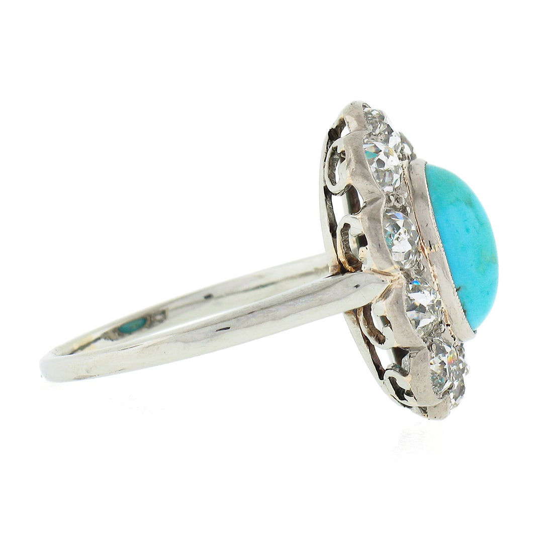 Antique Victorian 18k White Gold Turquoise Diamond Halo Ring: Antique Victorian 18k White Gold Turquoise Diamond Halo Ring Discover the elegance of this Antique Victorian ring, meticulously crafted in solid 18k white gold. The centerpiece features a natural