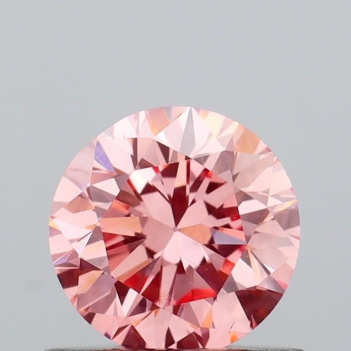 Loose Diamond - ROUND 0.6ct Fancy Vivid Pink VS2: Loose Diamond - ROUND 0.6ct Fancy Vivid Pink VS2 Source: This is a real non-mined Diamond that has been grown in a lab Shape: ROUND Carats: 0.6 Color: Fancy Vivid Pink Certification: IGI Video: