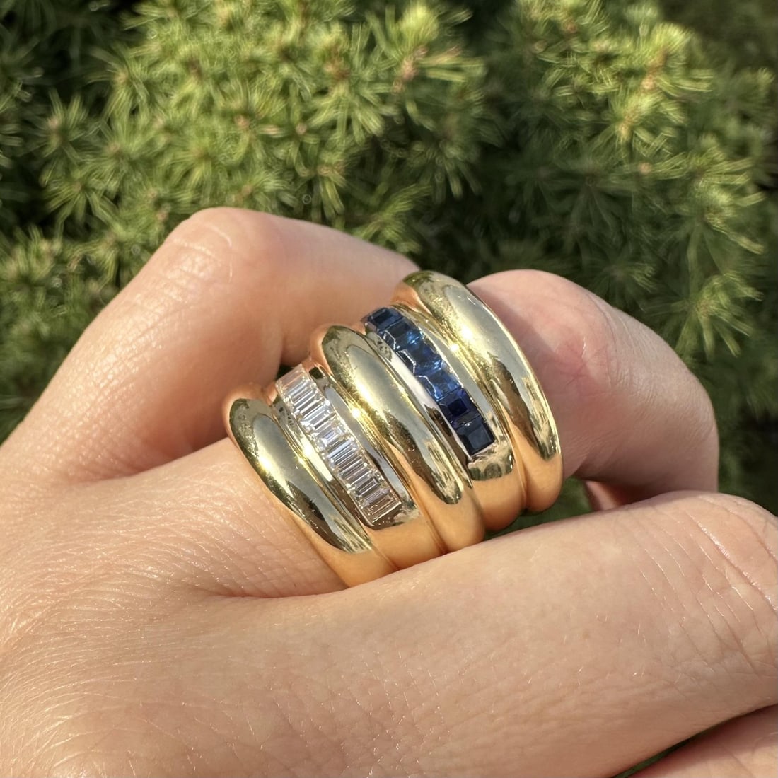 18k Yellow Gold 7ct Diamond Sapphire Wide Cigar Band Ring: 18k Yellow Gold 7ct Diamond Sapphire Wide Cigar Band Ring This stunning 18k yellow gold cigar band ring features a captivating design with both diamonds and sapphires. The ring showcases a total of