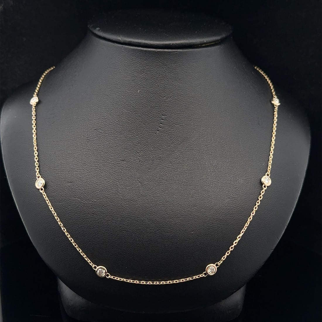 0.75ctw Diamond 10 Station 14k Yellow Gold By The Yard Chain Necklace: 0.75ctw Diamond 10 Station 14k Yellow Gold By The Yard Chain Necklace This is an un-used 14k yellow gold chain necklace featuring ten bezel-set, round brilliant cut natural diamonds with a total