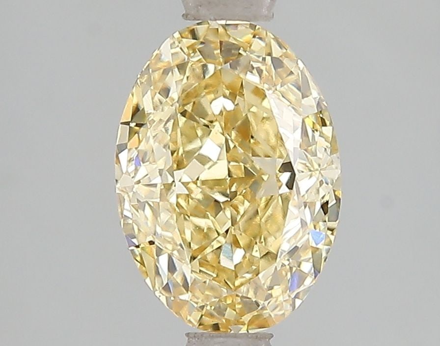 Loose Diamond - OVAL 2.1ct Fancy Vivid Yellow VS1: Loose Diamond - OVAL 2.1ct Fancy Vivid Yellow VS1 Source: This is a real non-mined Diamond that has been grown in a lab Shape: OVAL Carats: 2.1 Color: Fancy Vivid Yellow Certification: IGI Video: