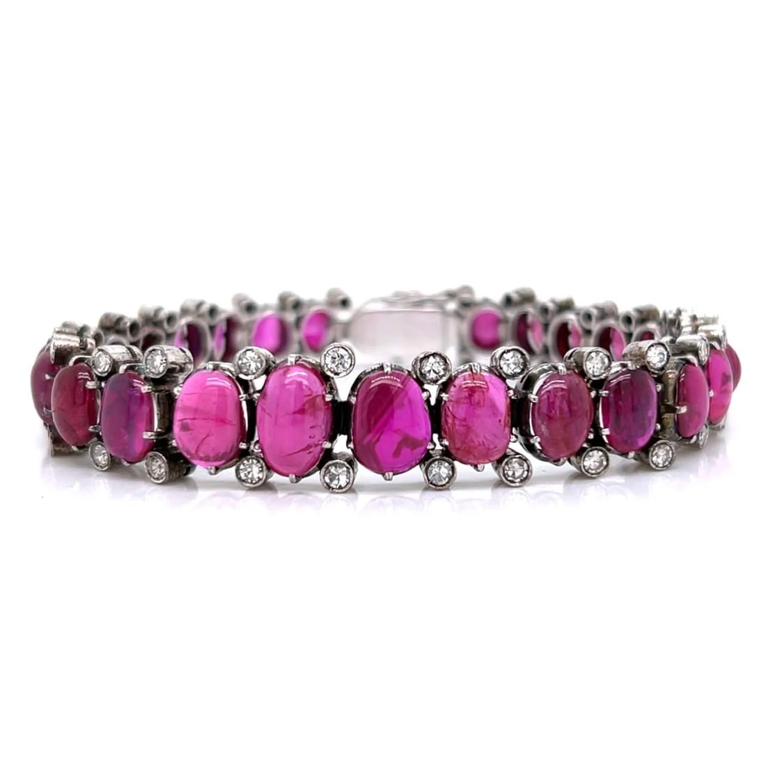 9K White Gold Silver Burma Ruby Diamond Bracelet 27 Stones 25 Ct: 9K White Gold Silver Burma Ruby Diamond Bracelet 27 Stones 25 Ct Elevate your jewelry collection with this stunning 9K White Gold and Silver Graduated Burma Ruby and Diamond Bracelet. This exquisite p