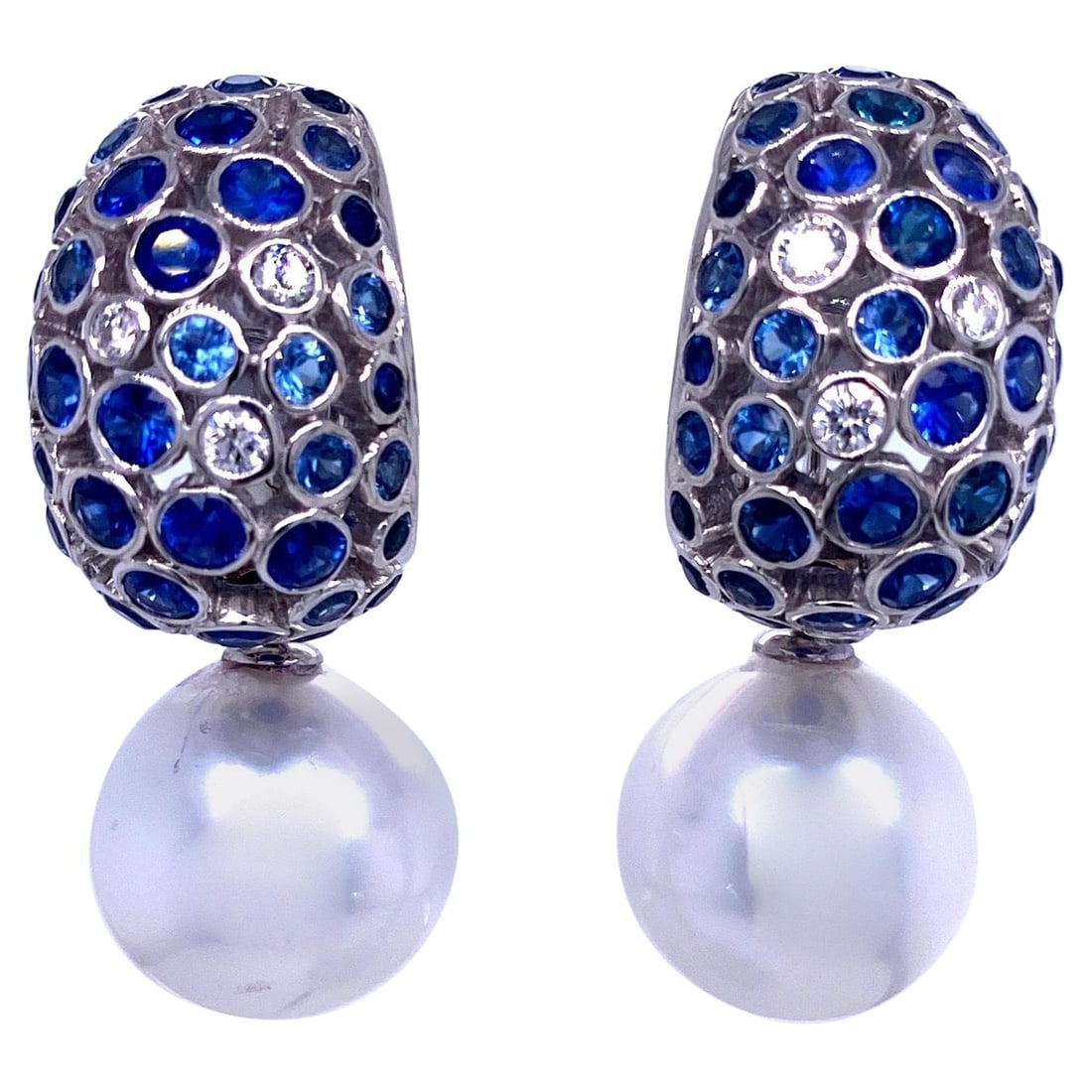 Harbor Diamonds 18K White Gold South Sea Pearl Sapphire Drop Earrings 6.96 Carat: Harbor Diamonds 18K White Gold South Sea Pearl Sapphire Drop Earrings 6.96 Carat Elevate your elegance with these stunning drop earrings crafted from 18K white gold. Featuring two exquisite South Sea 