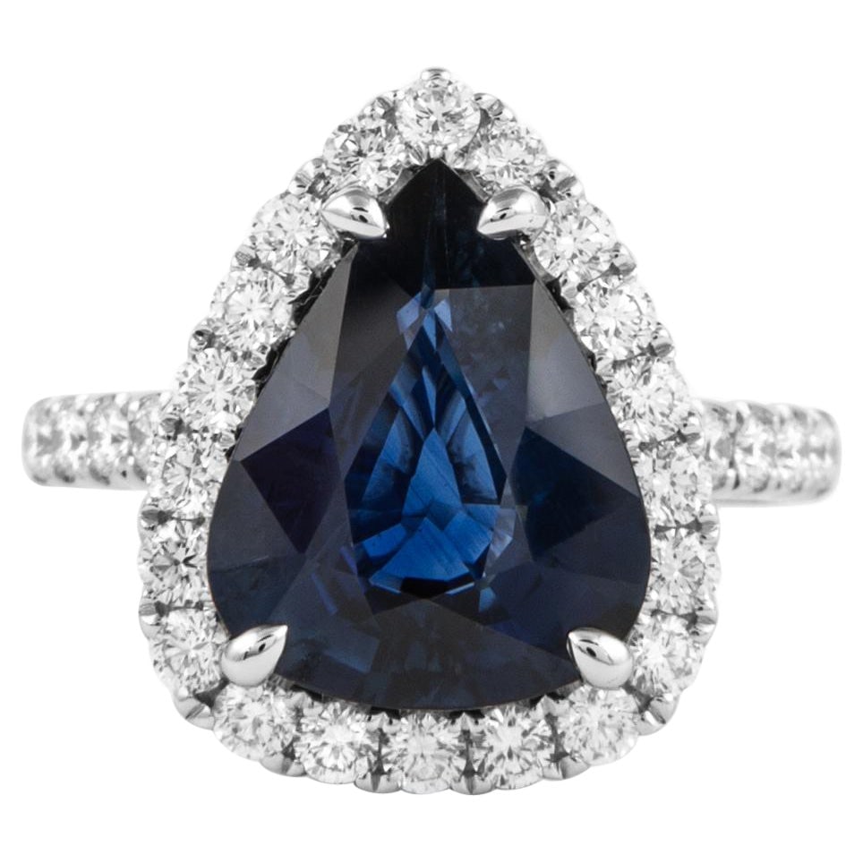 GIA 4.56ct Pear Sapphire Diamond Halo Ring 18k White Gold: GIA 4.56ct Pear Sapphire Diamond Halo Ring 18k White Gold This exquisite GIA certified ring features a stunning 4.56ct pear-shaped sapphire, beautifully complemented by a halo of 32 round brilliant di