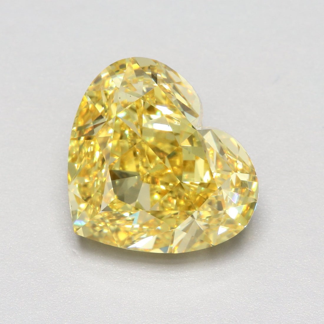 Loose Diamond - HEART 6.05ct Fancy Vivid Yellow VS1: Loose Diamond - HEART 6.05ct Fancy Vivid Yellow VS1 Source: This is a real non-mined Diamond that has been grown in a lab Shape: HEART Carats: 6.05 Color: Fancy Vivid Yellow Certification: IGI Video: