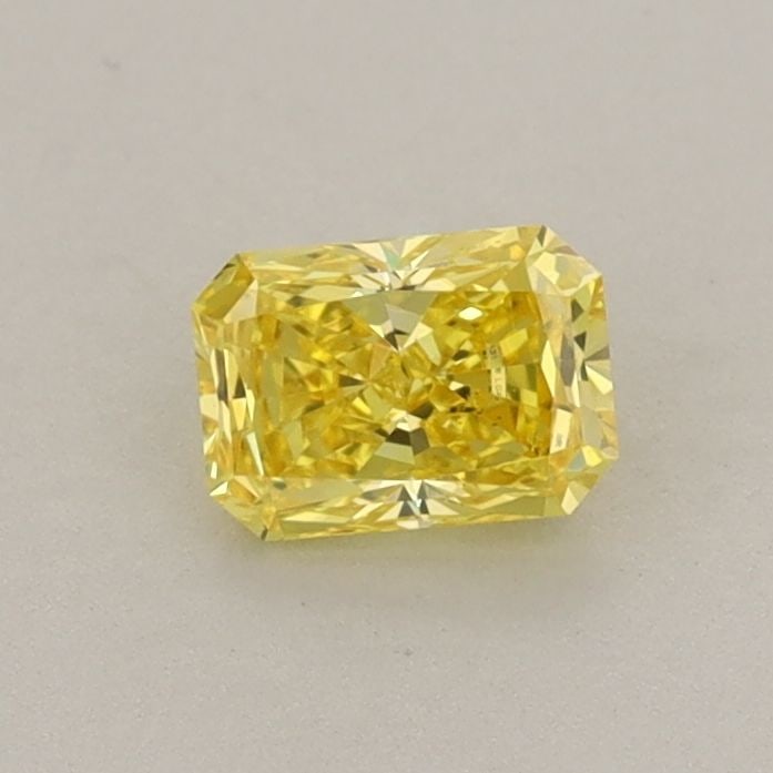 Loose Diamond - RADIANT 0.42ct Fancy Vivid Yellow VS2: Loose Diamond - RADIANT 0.42ct Fancy Vivid Yellow VS2 Source: This is a real non-mined Diamond that has been grown in a lab Shape: RADIANT Carats: 0.42 Color: Fancy Vivid Yellow Certification: IGI