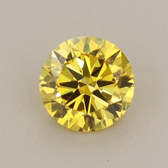 Loose Diamond - ROUND 0.6ct Fancy Vivid Yellow VVS2: Loose Diamond - ROUND 0.6ct Fancy Vivid Yellow VVS2 Source: This is a real non-mined Diamond that has been grown in a lab Shape: ROUND Carats: 0.6 Color: Fancy Vivid Yellow Certification: IGI Video: