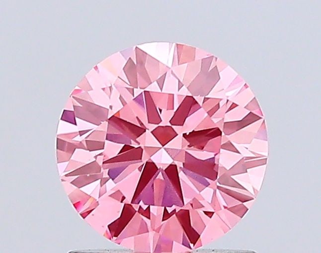 Ideal Loose Diamond - ROUND 1.04ct Fancy Vivid Pink VS1: Ideal Loose Diamond - ROUND 1.04ct Fancy Vivid Pink VS1 Source: This is a real non-mined Diamond that has been grown in a lab Shape: ROUND Carats: 1.04 Color: Fancy Vivid Pink Certification: IGI