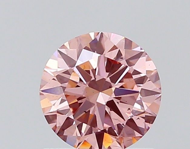 Loose Diamond - ROUND 0.74ct Fancy Vivid Pink SI1: Loose Diamond - ROUND 0.74ct Fancy Vivid Pink SI1 Source: This is a real non-mined Diamond that has been grown in a lab Shape: ROUND Carats: 0.74 Color: Fancy Vivid Pink Certification: NONE The
