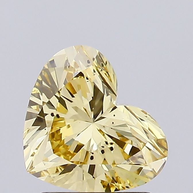 Loose Diamond - HEART 1.29ct Fancy Vivid Yellow SI1: Loose Diamond - HEART 1.29ct Fancy Vivid Yellow SI1 Source: This is a real non-mined Diamond that has been grown in a lab Shape: HEART Carats: 1.29 Color: Fancy Vivid Yellow Certification: NONE