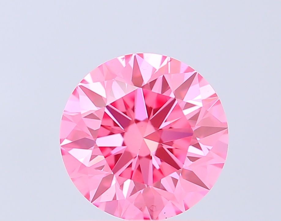 Ideal Loose Diamond - ROUND 1.5ct Fancy Vivid Pink VS2: Ideal Loose Diamond - ROUND 1.5ct Fancy Vivid Pink VS2 Source: This is a real non-mined Diamond that has been grown in a lab Shape: ROUND Carats: 1.5 Color: Fancy Vivid Pink Certification: IGI Video: