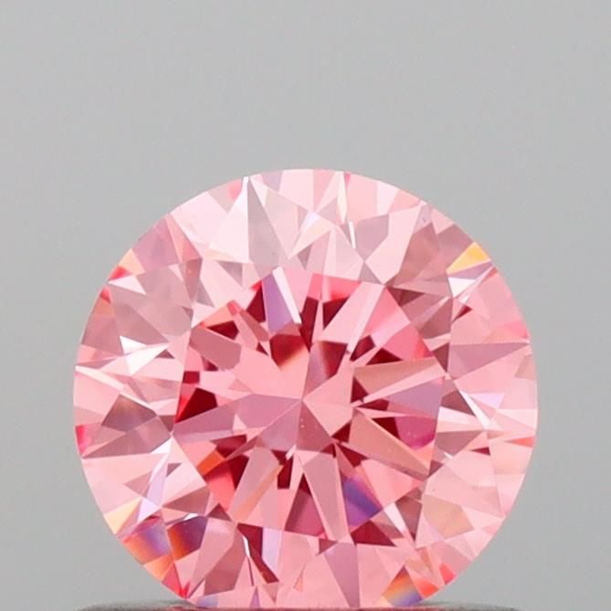 Loose Diamond - ROUND 0.6ct Fancy Vivid Pink VVS2: Loose Diamond - ROUND 0.6ct Fancy Vivid Pink VVS2 Source: This is a real non-mined Diamond that has been grown in a lab Shape: ROUND Carats: 0.6 Color: Fancy Vivid Pink Certification: IGI Video: