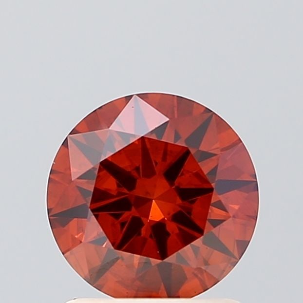 Ideal Loose Diamond - ROUND 1.07ct Fancy Vivid Orange SI2: Ideal Loose Diamond - ROUND 1.07ct Fancy Vivid Orange SI2 Source: This is a real non-mined Diamond that has been grown in a lab Shape: ROUND Carats: 1.07 Color: Fancy Vivid Orange Certification: IGI V
