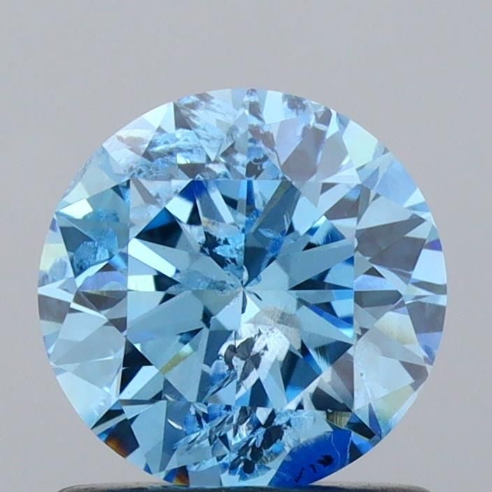 Ideal Loose Diamond - ROUND 0.94ct Fancy Vivid Blue I2: Ideal Loose Diamond - ROUND 0.94ct Fancy Vivid Blue I2 Source: This is a real non-mined Diamond that has been grown in a lab Shape: ROUND Carats: 0.94 Color: Fancy Vivid Blue Certification: IGI Video: