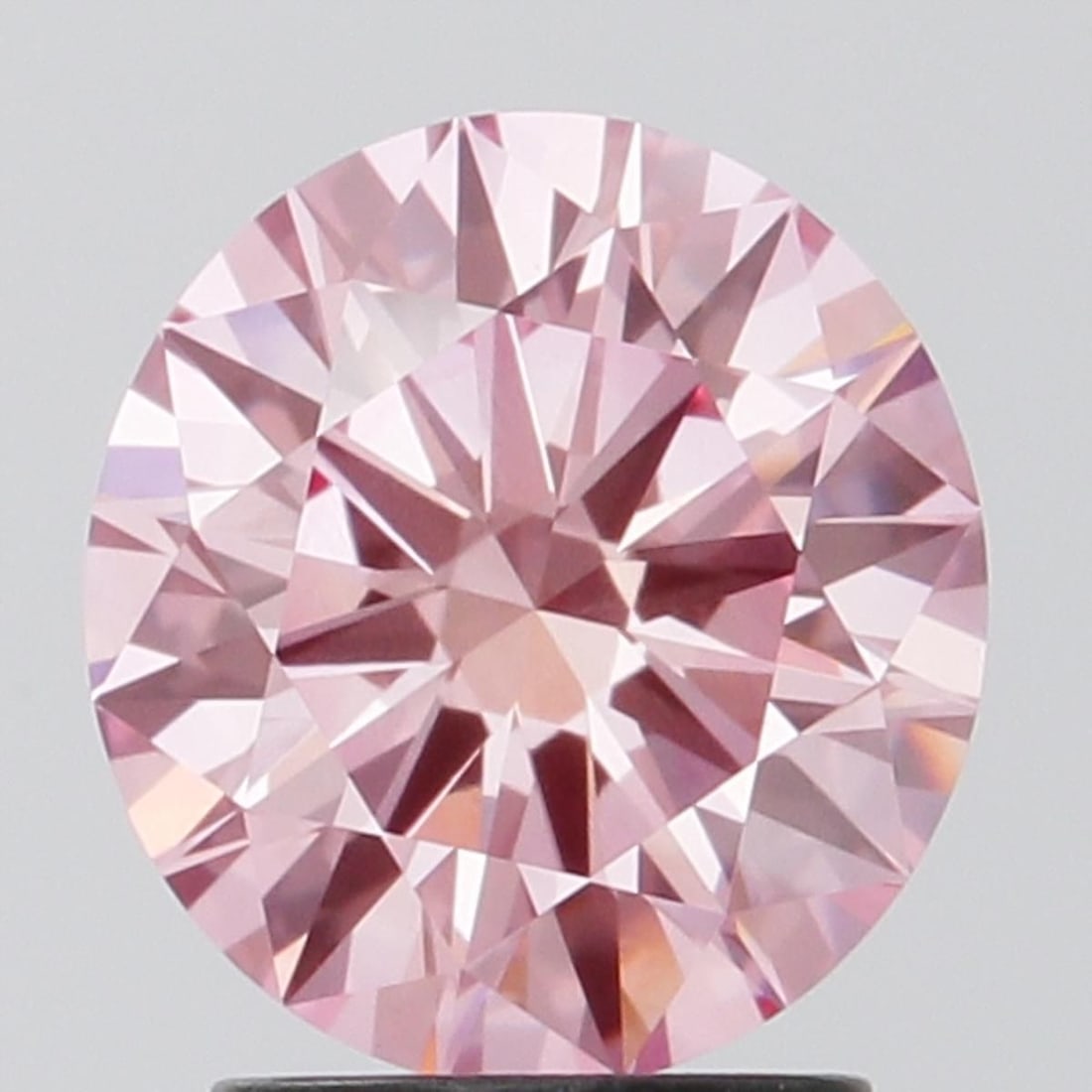 Loose Diamond - ROUND 1.98ct Fancy Vivid Pink VS1: Loose Diamond - ROUND 1.98ct Fancy Vivid Pink VS1 Source: This is a real non-mined Diamond that has been grown in a lab Shape: ROUND Carats: 1.98 Color: Fancy Vivid Pink Certification: IGI Video: