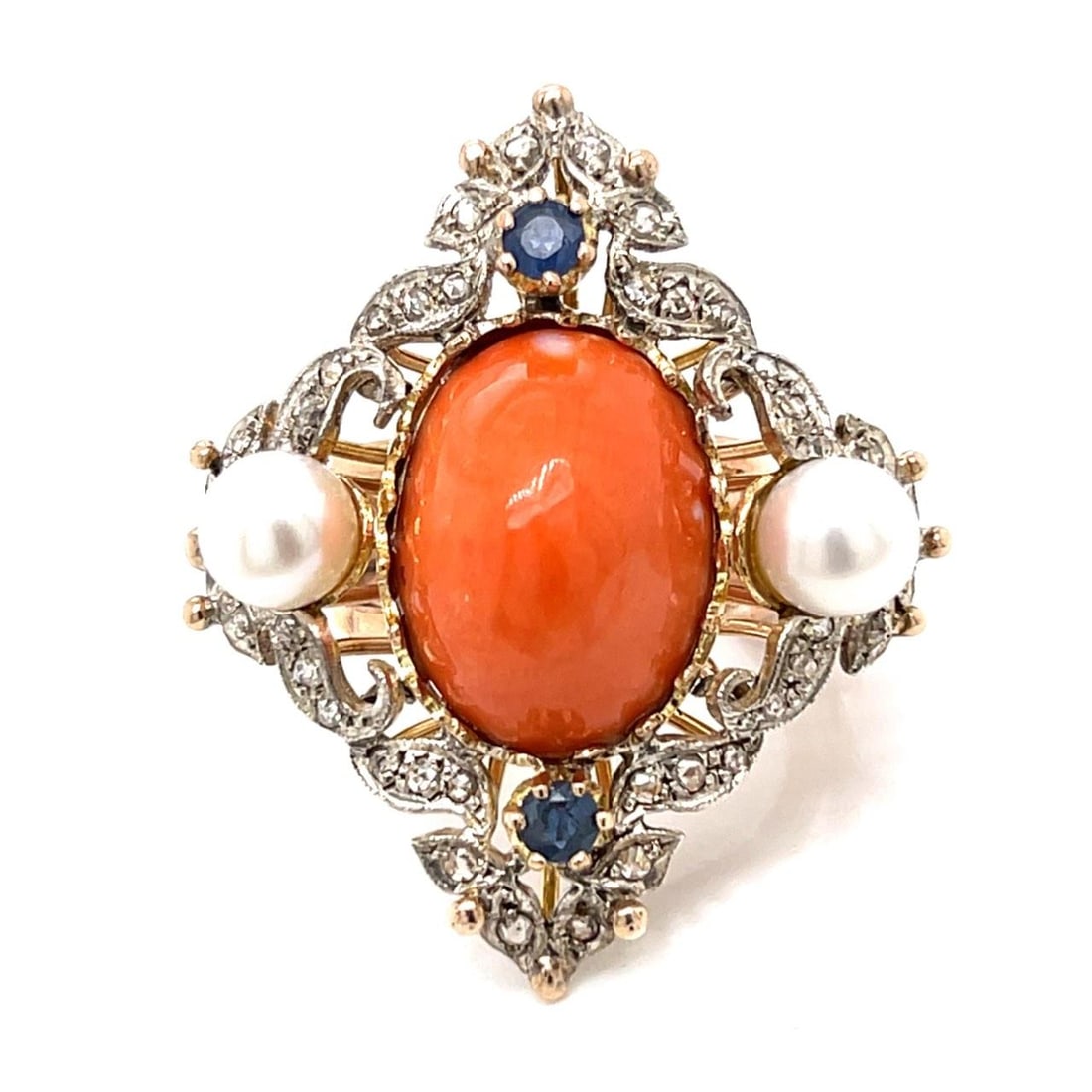Coral Sapphire Diamond Ring in 14K Rose Gold with Silver Top and Pearls: Coral Sapphire Diamond Ring in 14K Rose Gold with Silver Top and Pearls This pre-owned ring features a 14K rose gold band with a silver top, showcasing a 19.5 x 14.0 mm coral centerpiece. The ring is 