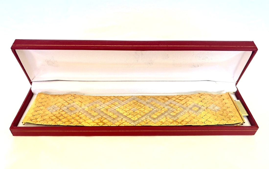 French 18K Yellow and White Gold Wrap Bracelet Signed 107.70 Grams: French 18K Yellow and White Gold Wrap Bracelet Signed 107.70 Grams This is a remarkable French wrap bracelet from the 1900s, crafted in 18K yellow and white gold. The reversible design features intric