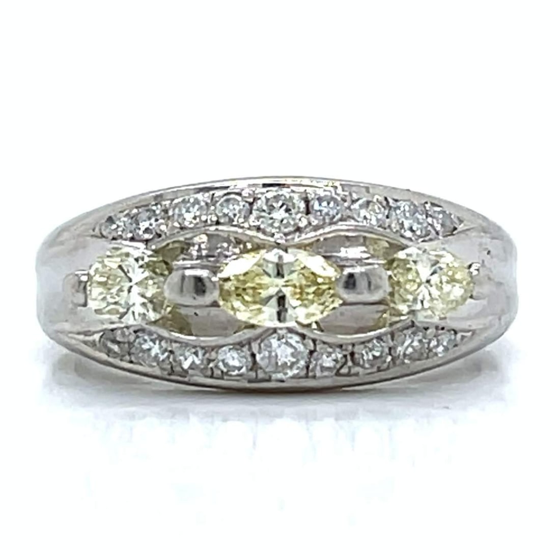 Platinum Ring with 3 Fancy Intense Yellow Diamonds 0.64 Ct: Platinum Ring with 3 Fancy Intense Yellow Diamonds 0.64 Ct This exquisite platinum ring features a stunning array of diamonds, including three Fancy Intense Yellow Marquise Diamonds totaling 0.64 Ct. 