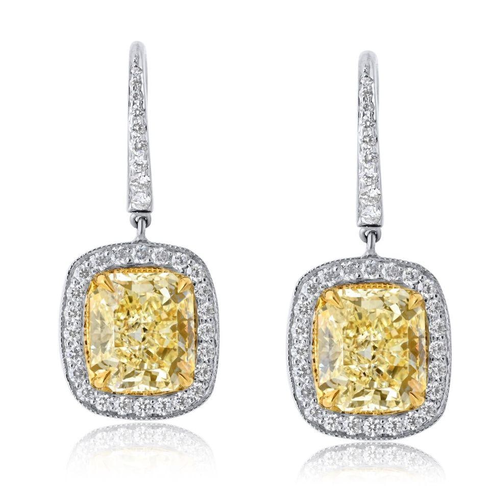 Radiant Cut Fancy Yellow Diamond Drop Earrings in Platinum and 18K Gold 3.73cttw: Radiant Cut Fancy Yellow Diamond Drop Earrings in Platinum and 18K Gold 3.73cttw These elegant drop earrings feature a total of 3.73 carats of fancy yellow radiant cut diamonds, set in a sophisticated