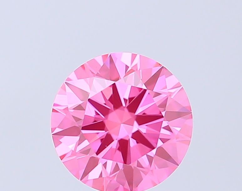 Ideal Loose Diamond - ROUND 1.04ct Fancy Vivid Pink VS1: Ideal Loose Diamond - ROUND 1.04ct Fancy Vivid Pink VS1 Source: This is a real non-mined Diamond that has been grown in a lab Shape: ROUND Carats: 1.04 Color: Fancy Vivid Pink Certification: IGI