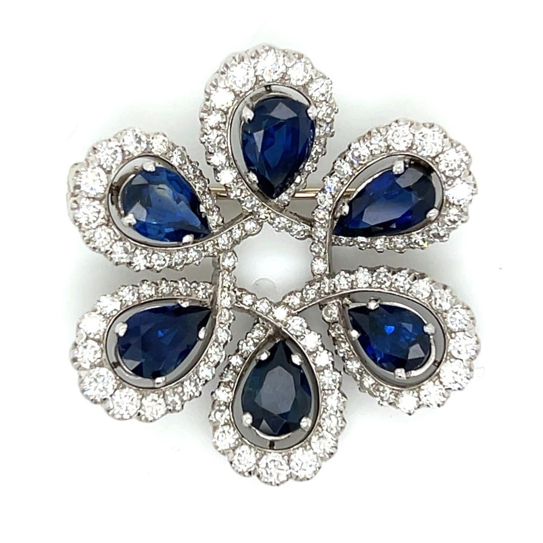 Platinum Art Deco Brooch with Sapphires and Diamonds 1.5 Inch: Platinum Art Deco Brooch with Sapphires and Diamonds 1.5 Inch This Art Deco brooch is crafted from platinum and features six sapphires with an approximate total weight of 9.00 carats. The brooch is fu