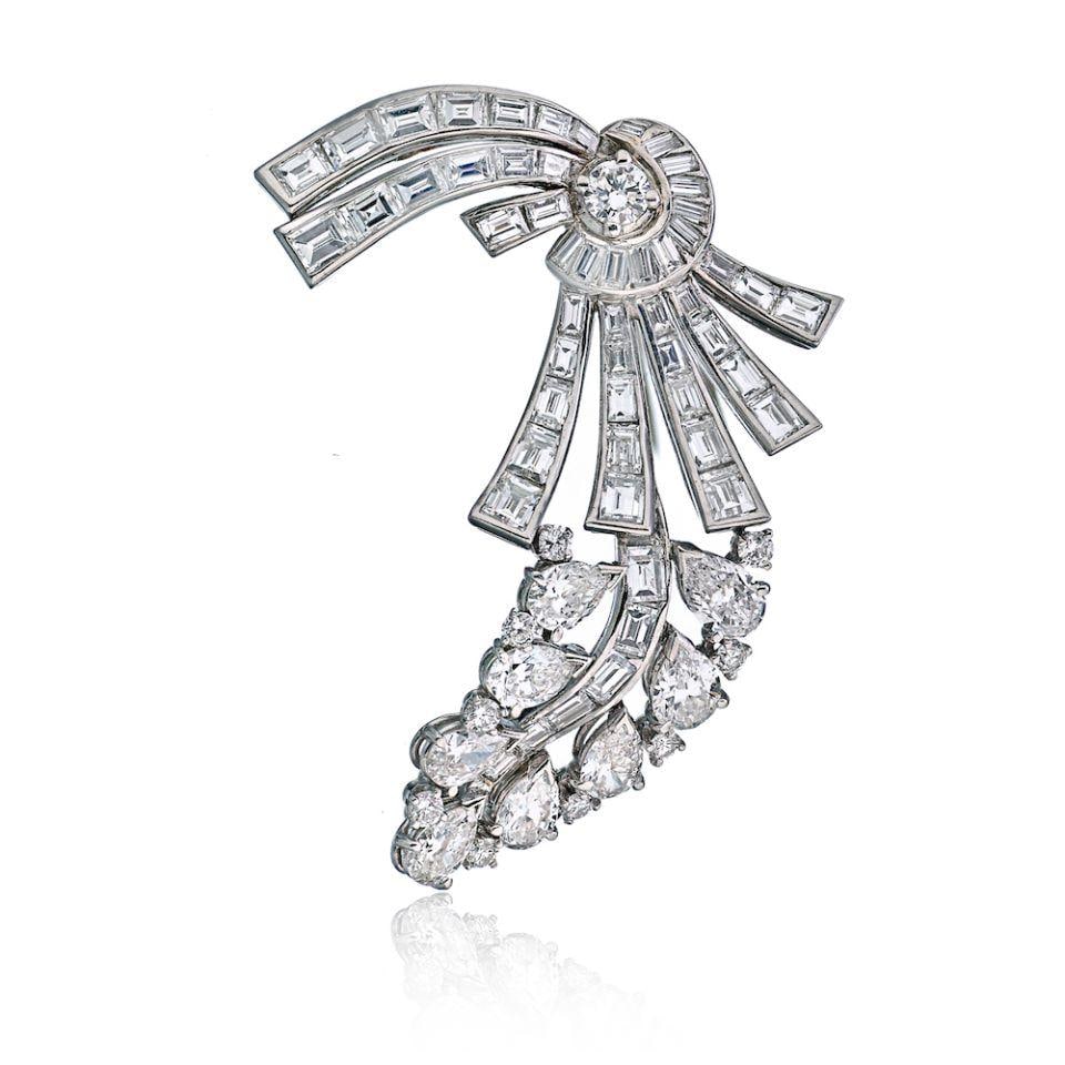 1950s Platinum Brooch with 10 Carats of Diamonds: 1950s Platinum Brooch with 10 Carats of Diamonds This exquisite brooch, crafted in platinum, dates back to the 1950s and features approximately 10 carats of dazzling diamonds. Weighing 17.5 grams, it 