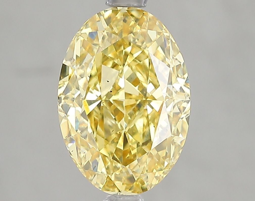 Loose Diamond - OVAL 3.01ct Fancy Vivid Yellow VS2: Loose Diamond - OVAL 3.01ct Fancy Vivid Yellow VS2 Source: This is a real non-mined Diamond that has been grown in a lab Shape: OVAL Carats: 3.01 Color: Fancy Vivid Yellow Certification: IGI Video: