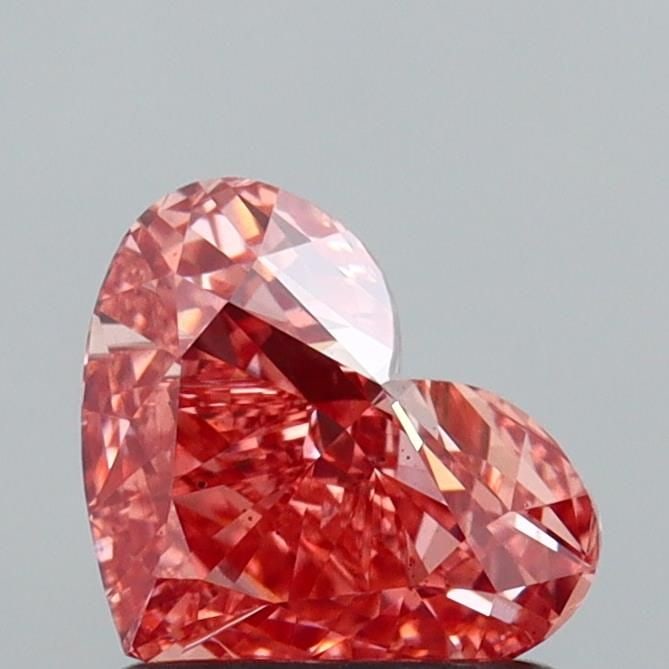 Loose Diamond - HEART 1.01ct Fancy Vivid Pink VS2: Loose Diamond - HEART 1.01ct Fancy Vivid Pink VS2 Source: This is a real non-mined Diamond that has been grown in a lab Shape: HEART Carats: 1.01 Color: Fancy Vivid Pink Certification: IGI Video: