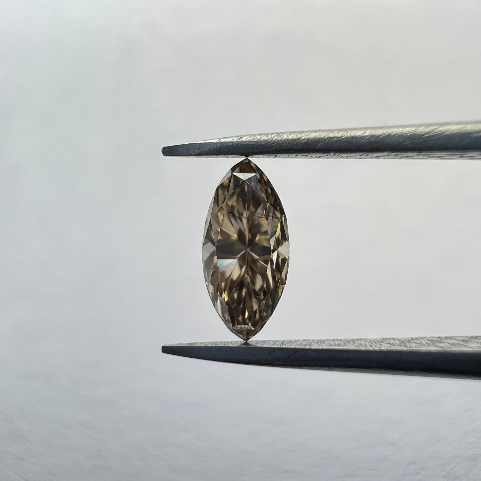 Loose Diamond - MARQUISE 0.15ct Brown SI1: Loose Diamond - MARQUISE 0.15ct Brown SI1 Source: This is a real non-mined Diamond that has been grown in a lab Shape: MARQUISE Carats: 0.15 Color: Brown Certification: NONE The Diamond Depot Guarante