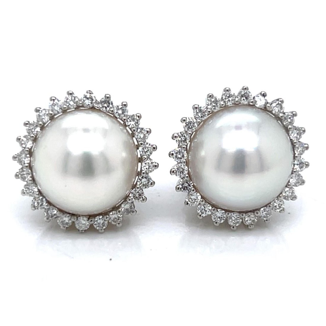 South Sea Pearl and Diamond Platinum Earrings with 48 Diamonds: South Sea Pearl and Diamond Platinum Earrings with 48 Diamonds Elegant earrings crafted in platinum, featuring South Sea pearls measuring 11.7mm. Each earring is set with 48 diamonds totaling approxim