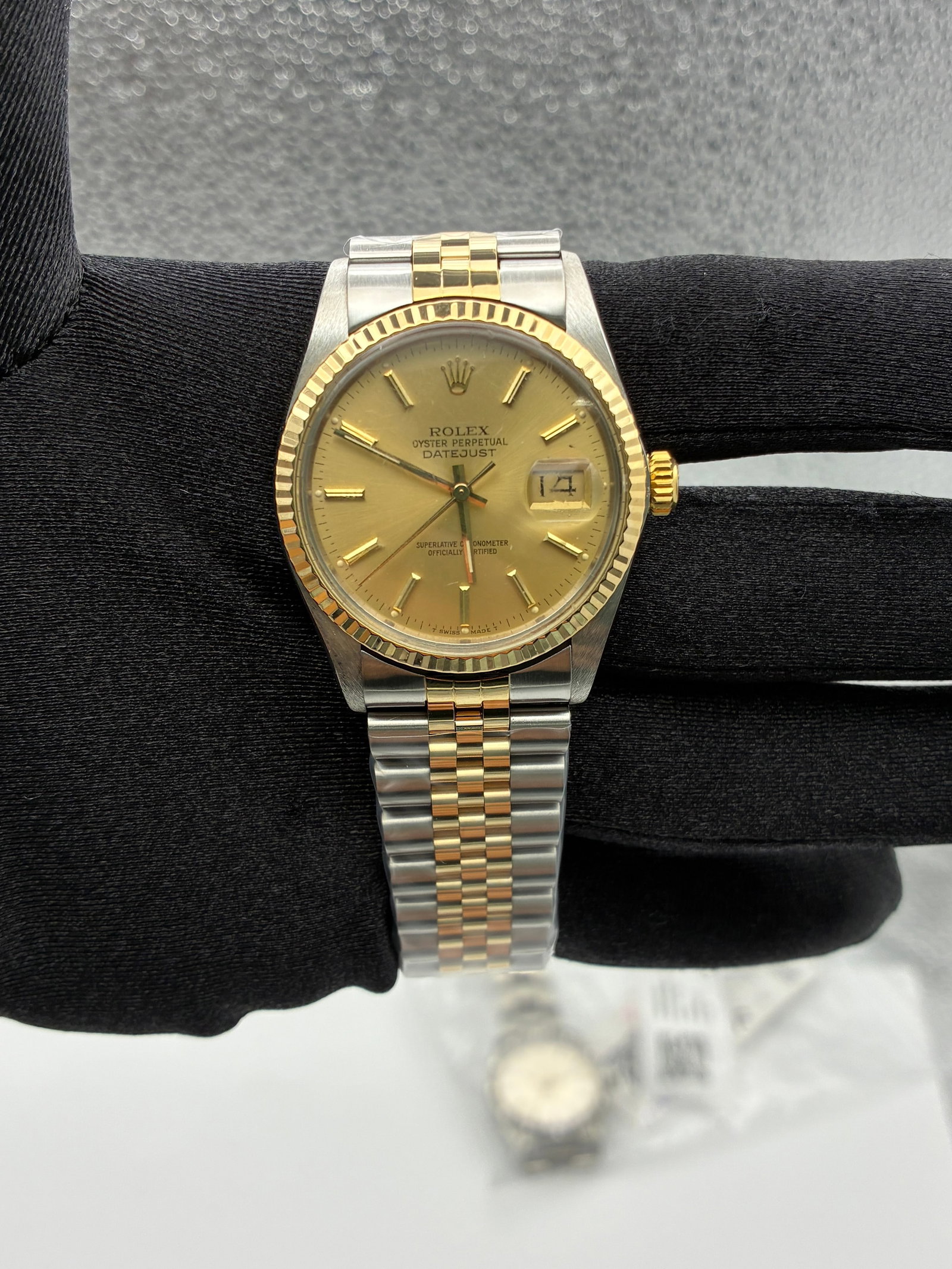 Rolex Datejust 16013 Champagne Stick Dial Aftermarket Jubilee Bracelet: Rolex Datejust 16013 Champagne Stick Dial Aftermarket Jubilee Bracelet This Rolex Datejust features a champagne stick dial and a fluted bezel, paired with an aftermarket Jubilee bracelet. The watch is