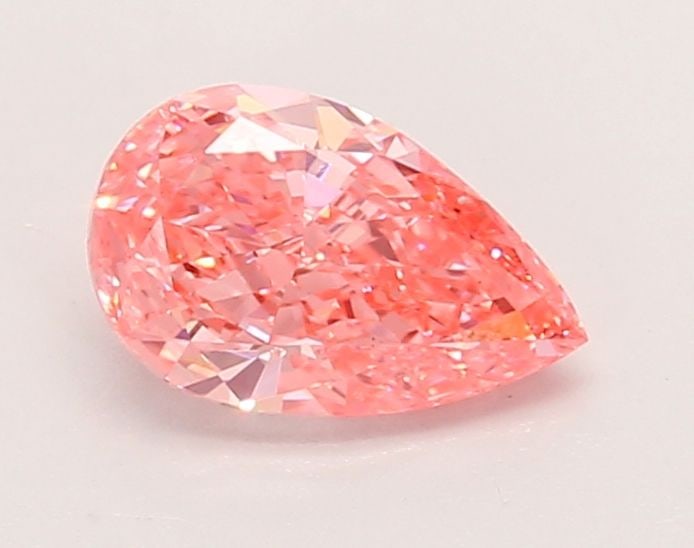 Loose Diamond - PEAR 0.88ct Fancy Vivid Pink VS1: Loose Diamond - PEAR 0.88ct Fancy Vivid Pink VS1 Source: This is a real non-mined Diamond that has been grown in a lab Shape: PEAR Carats: 0.88 Color: Fancy Vivid Pink Certification: IGI Video: