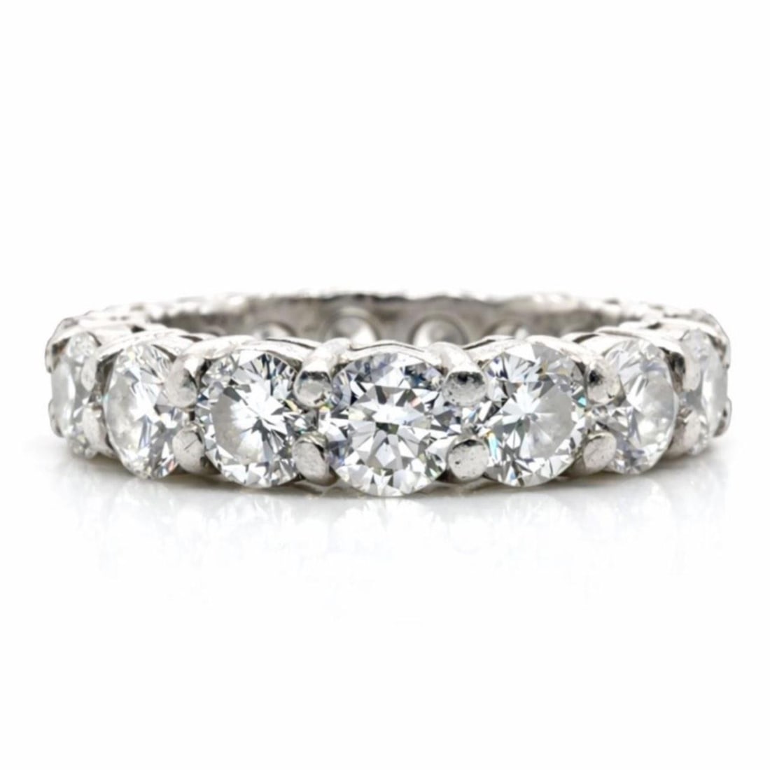 3.50 Carat Diamond Eternity Ring in Platinum Size 5: 3.50 Carat Diamond Eternity Ring in Platinum Size 5 This platinum eternity band features 17 diamonds with a total weight of approximately 3.50 carats. The diamonds exhibit F-G color and VVS-VS clarity