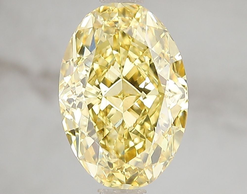 Loose Diamond - OVAL 3.01ct Fancy Vivid Yellow VS2: Loose Diamond - OVAL 3.01ct Fancy Vivid Yellow VS2 Source: This is a real non-mined Diamond that has been grown in a lab Shape: OVAL Carats: 3.01 Color: Fancy Vivid Yellow Certification: IGI Video: