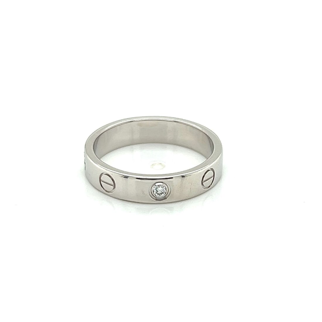 Cartier Mini Love 18k White Gold Diamond Band Ring Size 5.5: Cartier Mini Love 18k White Gold Diamond Band Ring Size 5.5 This Cartier Mini Love band ring is crafted from solid 18k white gold and features a single sparkling diamond with an approximate total weig