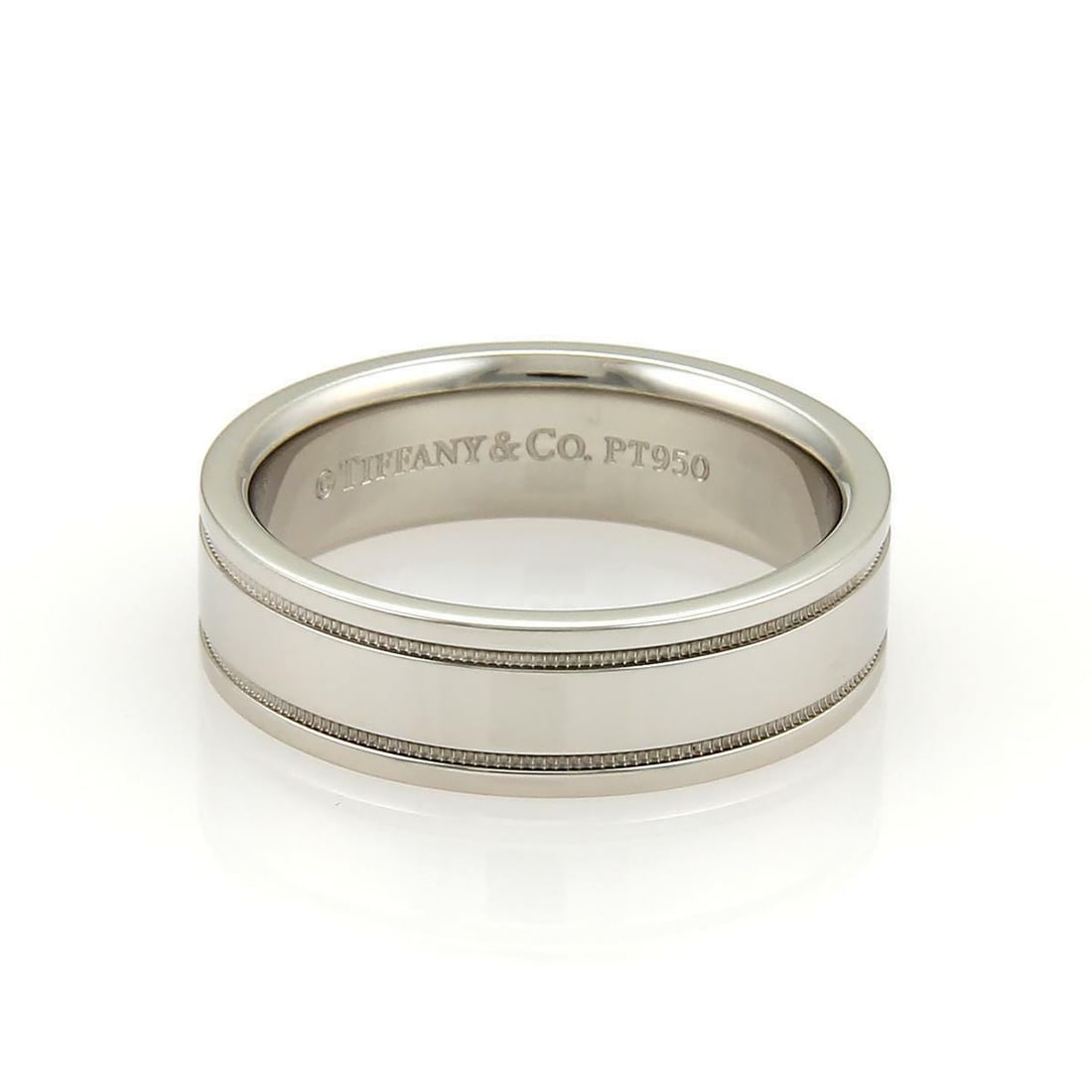 Platinum Milgrain 6mm Wide Wedding Band Size 9.5 by Tiffany & Co.: Platinum Milgrain 6mm Wide Wedding Band Size 9.5 by Tiffany & Co. This Tiffany & Co. wedding band features a simple yet elegant design crafted from platinum with a brushed satin finish. The ring showc