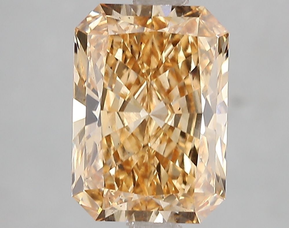 Loose Diamond - RADIANT 3.09ct Fancy Vivid Orangey Yellow SI1: Loose Diamond - RADIANT 3.09ct Fancy Vivid Orangey Yellow SI1 Source: This is a real non-mined Diamond that has been grown in a lab Shape: RADIANT Carats: 3.09 Color: Fancy Vivid Orangey Yellow Certif