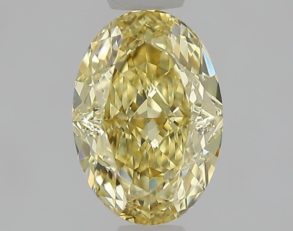 Loose Diamond - OVAL 1.07ct Fancy Yellow VVS1: Loose Diamond - OVAL 1.07ct Fancy Yellow VVS1 Source: This is a real non-mined Diamond that has been grown in a lab Shape: OVAL Carats: 1.07 Color: Fancy Yellow Certification: IGI Video: