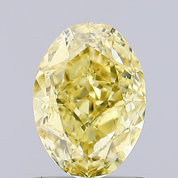 Loose Diamond - OVAL 0.93ct Fancy Vivid Yellow VS2: Loose Diamond - OVAL 0.93ct Fancy Vivid Yellow VS2 Source: This is a real non-mined Diamond that has been grown in a lab Shape: OVAL Carats: 0.93 Color: Fancy Vivid Yellow Certification: IGI Video: