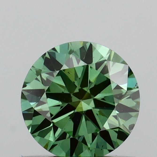 Loose Diamond - ROUND 0.6ct Fancy Vivid Green VS2: Loose Diamond - ROUND 0.6ct Fancy Vivid Green VS2 Source: This is a real non-mined Diamond that has been grown in a lab Shape: ROUND Carats: 0.6 Color: Fancy Vivid Green Certification: IGI Video: