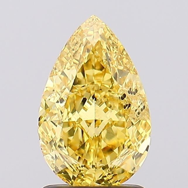 Loose Diamond - PEAR 1.65ct Fancy Vivid Yellow SI2: Loose Diamond - PEAR 1.65ct Fancy Vivid Yellow SI2 Source: This is a real non-mined Diamond that has been grown in a lab Shape: PEAR Carats: 1.65 Color: Fancy Vivid Yellow Certification: IGI Video:
