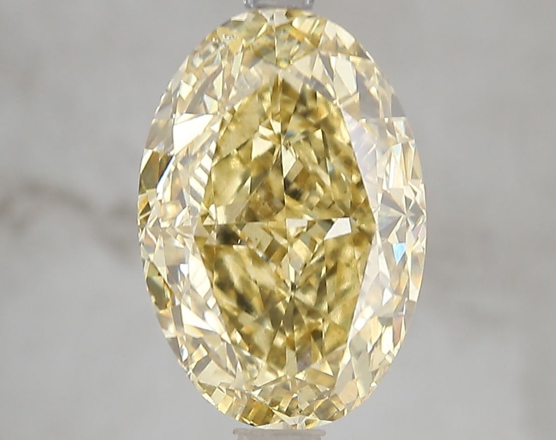Loose Diamond - OVAL 5.02ct Fancy Vivid Yellow VS2: Loose Diamond - OVAL 5.02ct Fancy Vivid Yellow VS2 Source: This is a real non-mined Diamond that has been grown in a lab Shape: OVAL Carats: 5.02 Color: Fancy Vivid Yellow Certification: IGI Video: