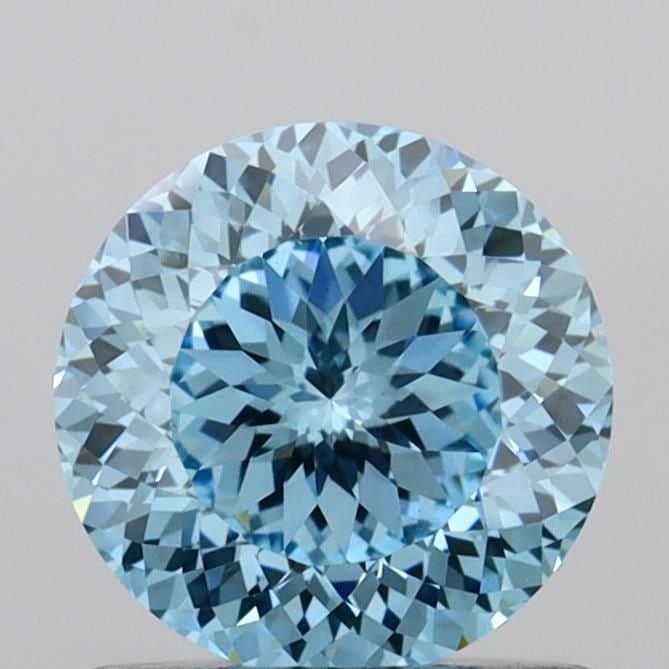 Loose Diamond - ROUND 0.94ct Fancy Vivid Blue VVS2: Loose Diamond - ROUND 0.94ct Fancy Vivid Blue VVS2 Source: This is a real non-mined Diamond that has been grown in a lab Shape: ROUND Carats: 0.94 Color: Fancy Vivid Blue Certification: IGI Video: