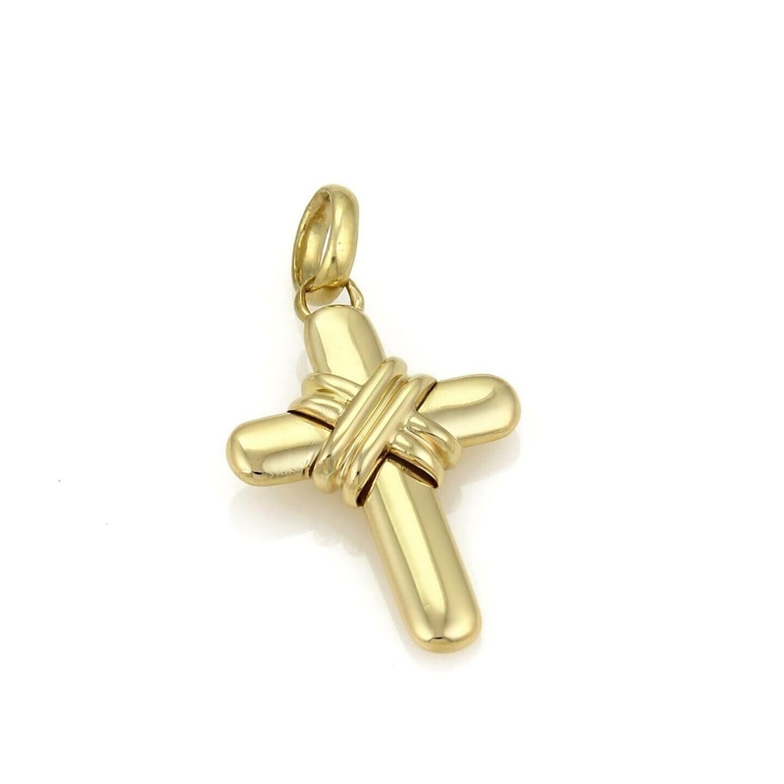 Bvlgari 18k Yellow Gold Cross Charm Pendant: Bvlgari 18k Yellow Gold Cross Charm Pendant This authentic Bvlgari X Wrap Cross charm pendant is crafted from 18k yellow gold and features a bold sculptural cross design with elegant wrapped detailing