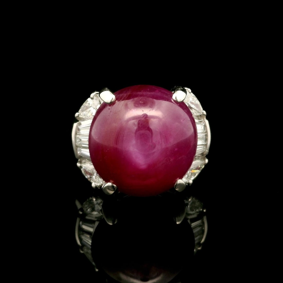 Vintage GIA Certified 11.18ct No Heat Star Ruby Platinum Ring with Diamonds: Vintage GIA Certified 11.18ct No Heat Star Ruby Platinum Ring with Diamonds This exquisite vintage cocktail ring showcases a stunning natural star ruby from Burma, weighing 10.55 carats. The ruby feat