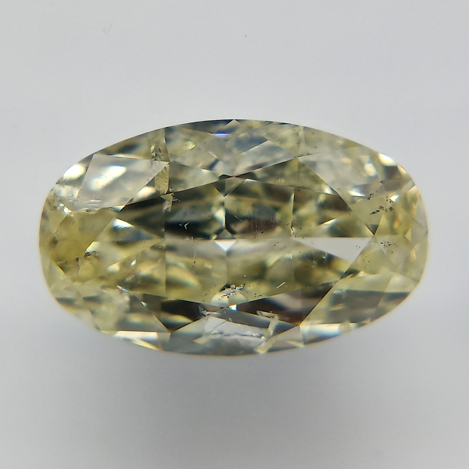 Loose Diamond - OVAL 1.06ct Fancy Light Yellow: Loose Diamond - OVAL 1.06ct Fancy Light Yellow Source: Natural Shape: OVAL Carats: 1.06 Color: Fancy Light Yellow Certification: GIA The Diamond Depot Guarantee: All items in this auction are guarante
